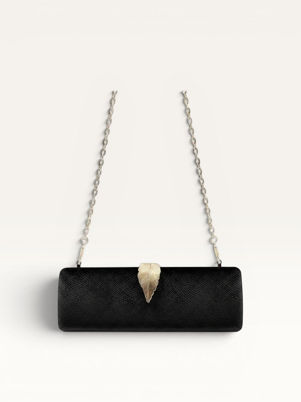 Adan & Co. black velvet clutch bag with gold leaf clasp and chain strap. Hard, rectangular shape with internal pockets.