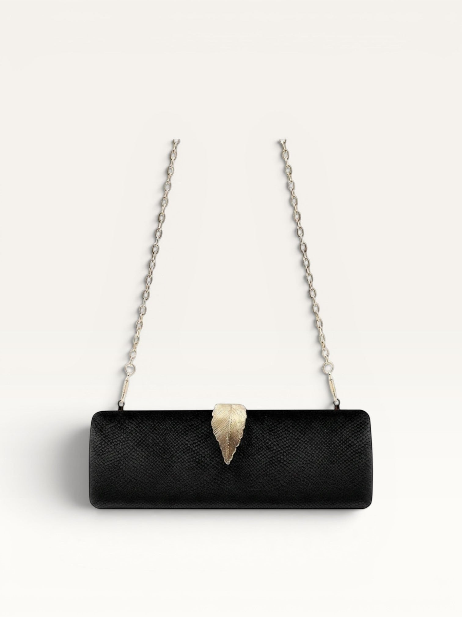 Adan & Co. black velvet clutch bag with gold leaf clasp and chain strap. Hard, rectangular shape with internal pockets.